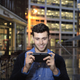 Illustration for article titled Attractive Young Men Smiling at the PlayStation Vita